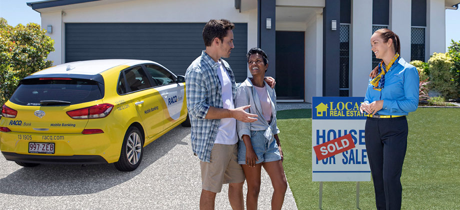 RACQ loan staff with house owner 